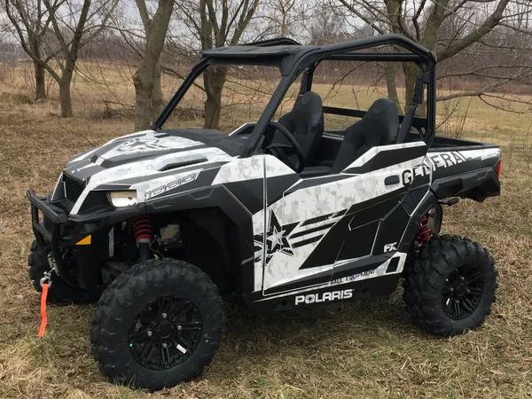 A Polaris General 2 Door side-by-side with a white, black, and dark gray digital camo custom vinyl wrap.