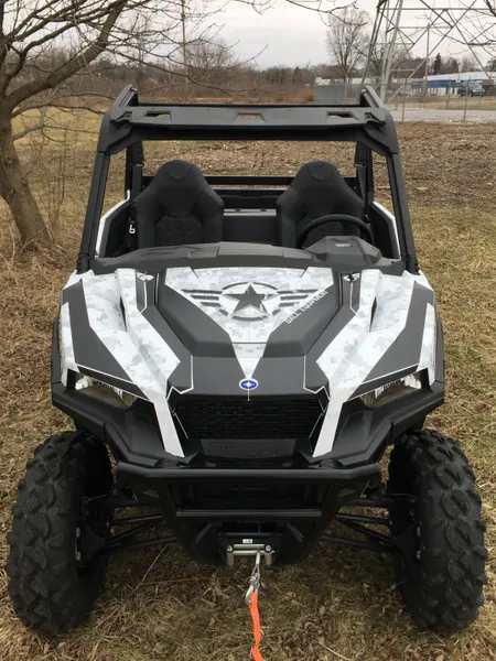 A Polaris General 2 Door side-by-side with a  gray and black digital camo star custom vinyl wrap.