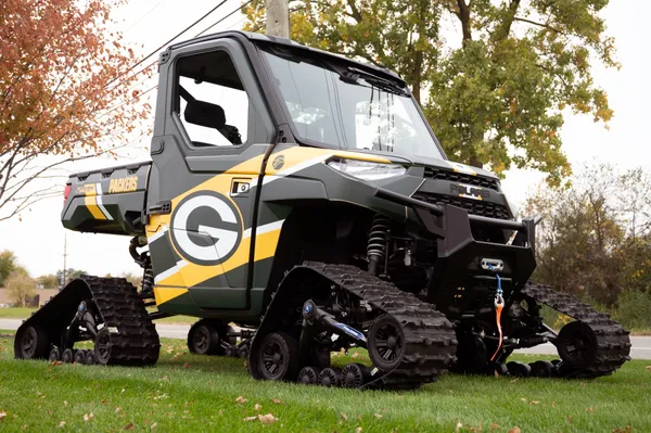 A Polaris Ranger 2 Door side-by-side with a Green bay Packers custom vinyl wrap.