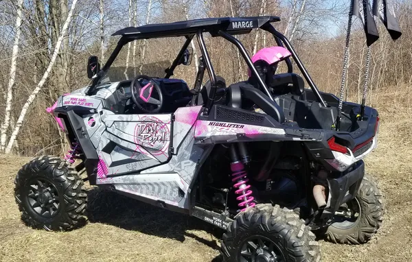 A Polaris RZR XP 2 Door 2018+ side-by-side with a white, gray, and pink grunge Bombsquad custom vinyl wrap.