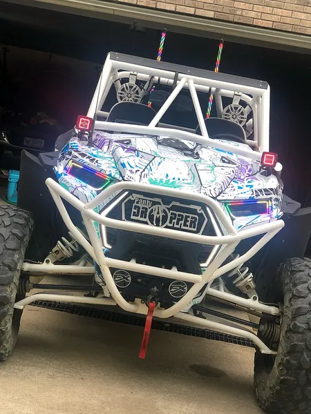 A Polaris RZR XP 2 Door 2018+ side-by-side with a white, blue, and purple sketch grunge Wicked custom vinyl wrap.